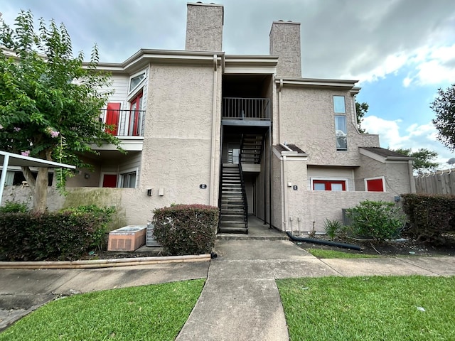 10855 Meadowglen Ln Unit 723, Houston, TX 77042 - view of property featuring stairway