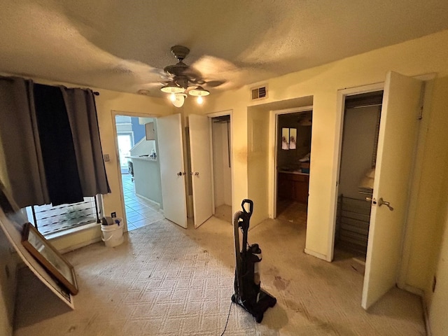10855 Meadowglen Ln Unit 723, Houston, TX 77042 - unfurnished bedroom with two closets, a ceiling fan, and light carpet