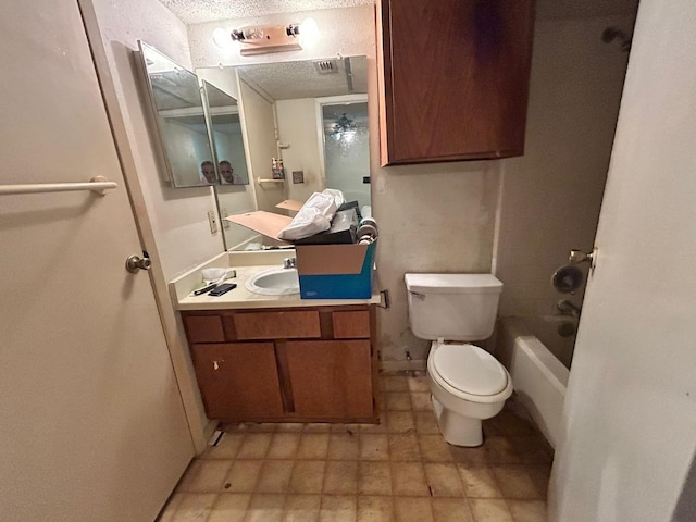 10855 Meadowglen Ln Unit 723, Houston, TX 77042 - bathroom with toilet, vanity, and a textured ceiling