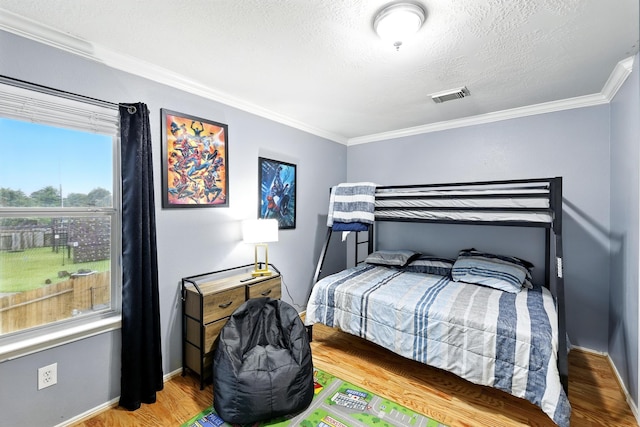 3002 Trinity Pass Ct, Spring, TX 77373 - bedroom with crown molding and wood finished floors