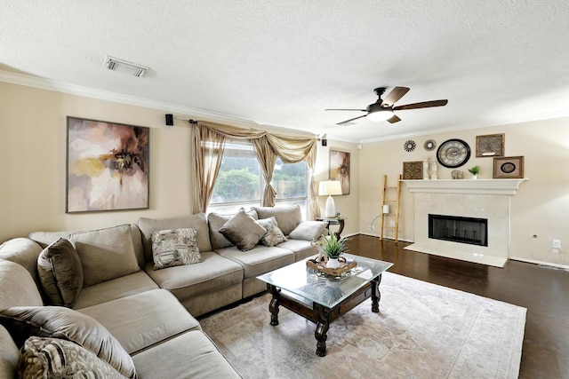 3002 Trinity Pass Ct, Spring, TX 77373 - living area featuring ornamental molding, a ceiling fan, wood finished floors, a high end fireplace, and a textured ceiling