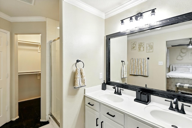 3002 Trinity Pass Ct, Spring, TX 77373 - ensuite bathroom featuring a spacious closet, a shower stall, double vanity, and crown molding