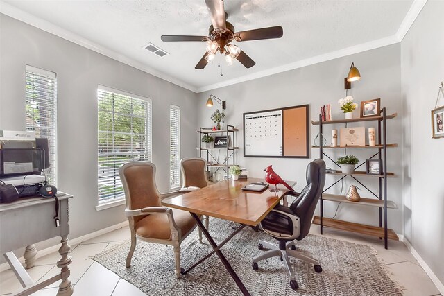 14222 Autumn Mist, Cypress, TX 77429 - office area with healthy amount of natural light, ceiling fan, light tile patterned floors, baseboards, and ornamental molding