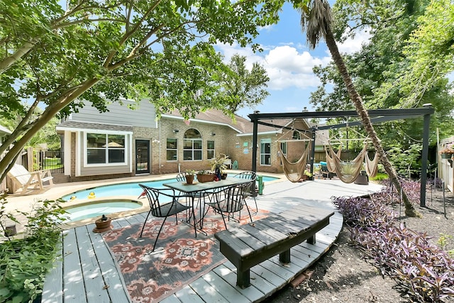 14222 Autumn Mist, Cypress, TX 77429 - rear view of house with an in-ground hot tub, an outdoor pool, brick siding, and a deck