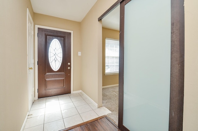 7811 Holly Berry Ct, Cypress, TX 77433 - foyer entrance with plenty of natural light, baseboards, and light tile patterned floors