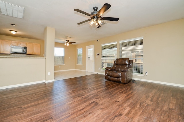 7811 Holly Berry Ct, Cypress, TX 77433 - living area featuring wood finished floors, ceiling fan, and baseboards