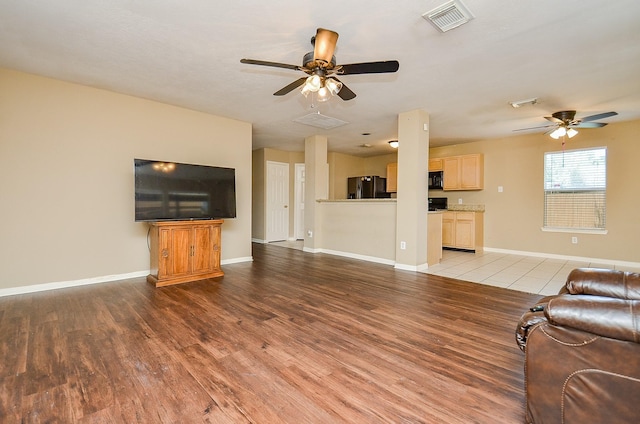 7811 Holly Berry Ct, Cypress, TX 77433 - unfurnished living room featuring ceiling fan, wood finished floors, and baseboards