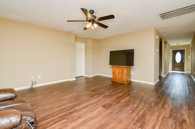 7811 Holly Berry Ct, Cypress, TX 77433 - unfurnished living room featuring wood finished floors, baseboards, and a ceiling fan