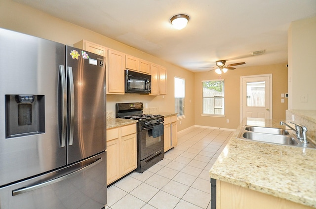 7811 Holly Berry Ct, Cypress, TX 77433 - kitchen with black appliances, a sink, light tile patterned flooring, and light countertops