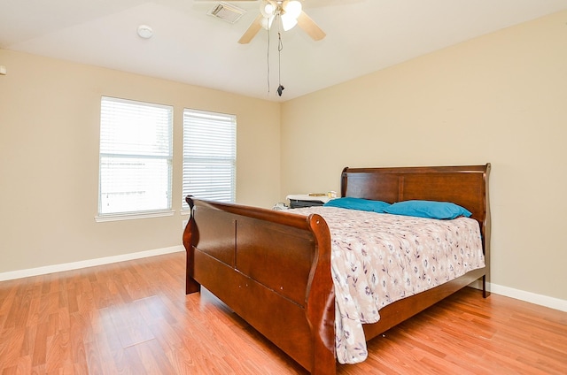 7811 Holly Berry Ct, Cypress, TX 77433 - bedroom featuring light wood finished floors, baseboards, and ceiling fan
