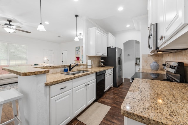 1603 Culture Ln, College Station, TX 77845 - kitchen with a sink, stainless steel appliances, a peninsula, white cabinetry, and a ceiling fan
