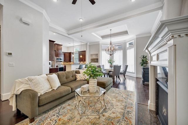 2010 Sabine St, Houston, TX 77007 - living area featuring a premium fireplace, baseboards, a raised ceiling, a chandelier, and ceiling fan