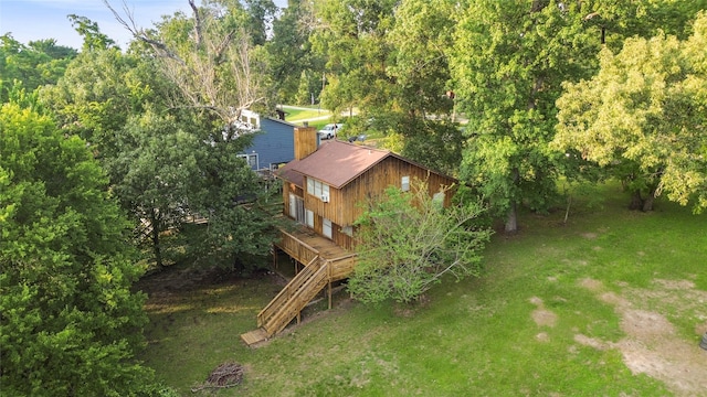 7 Lake Dr, Huntsville, TX 77320 - view of green lawn featuring a wooden deck and stairs