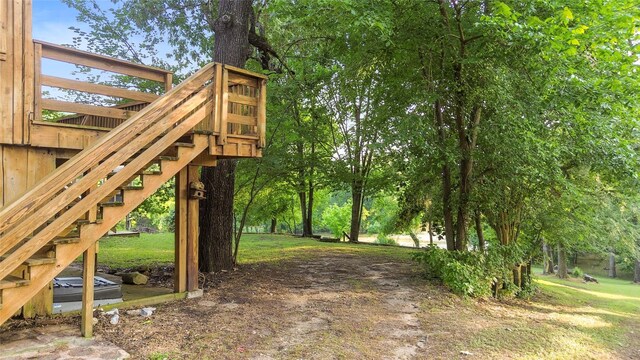 7 Lake Dr, Huntsville, TX 77320 - view of home's community with stairway and a lawn