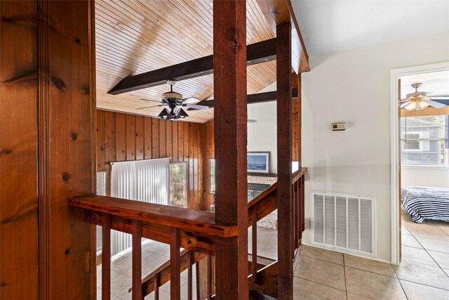 7 Lake Dr, Huntsville, TX 77320 - corridor featuring tile patterned flooring, wood walls, and wooden ceiling with exposed beams