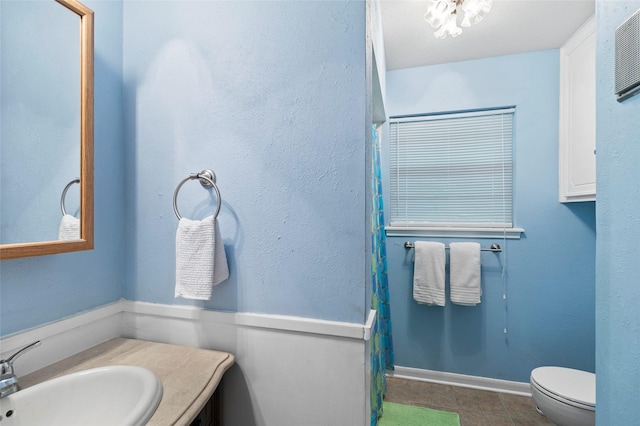 7 Lake Dr, Huntsville, TX 77320 - bathroom with toilet, tile patterned floors, vanity, and a shower with curtain