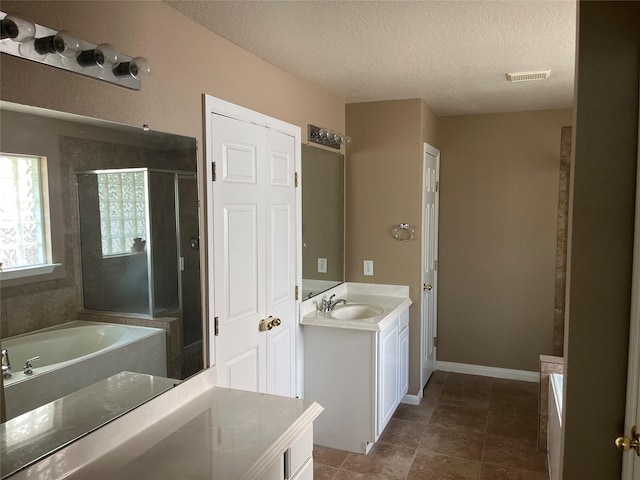 10406 Friars Hill Ln, Houston, TX 77070 - full bath featuring vanity, a garden tub, a textured ceiling, and a shower stall