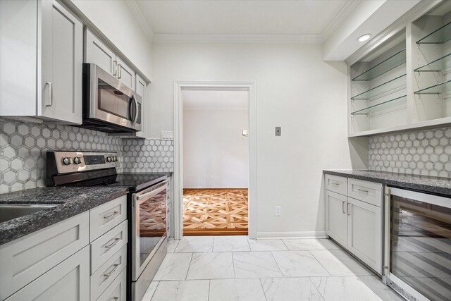 2901 Bammel Ln Unit 17, Houston, TX 77098 - kitchen featuring appliances with stainless steel finishes, beverage cooler, dark stone counters, crown molding, and open shelves