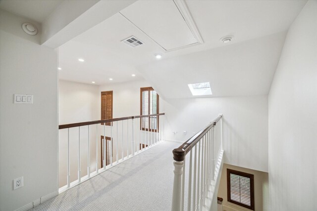 2901 Bammel Ln Unit 17, Houston, TX 77098 - hall featuring attic access, carpet floors, an upstairs landing, recessed lighting, and a skylight