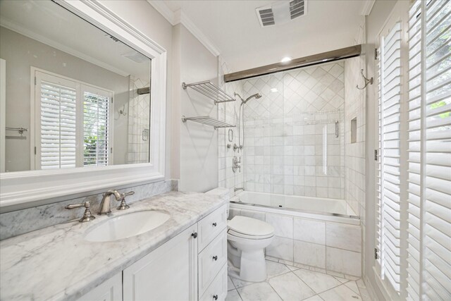 2901 Bammel Ln Unit 17, Houston, TX 77098 - full bath with crown molding, tiled shower / bath, vanity, tile patterned floors, and toilet