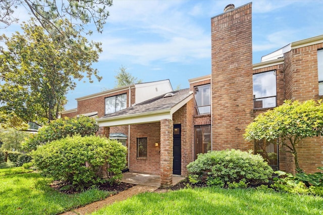 2901 Bammel Ln Unit 17, Houston, TX 77098 - view of front of home with brick siding and a chimney