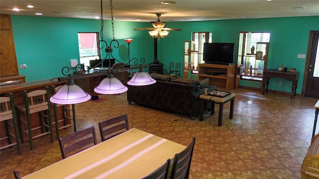 2301 Hines Lake Rd, Coldspring, TX 77331 - living area with a wood stove, tile patterned floors, a ceiling fan, and recessed lighting