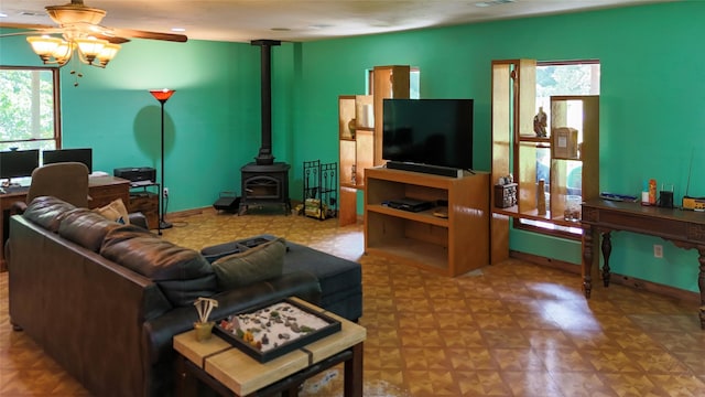 2301 Hines Lake Rd, Coldspring, TX 77331 - living area with ceiling fan and a wood stove