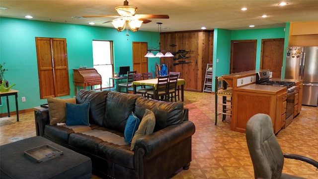 2301 Hines Lake Rd, Coldspring, TX 77331 - living area featuring a ceiling fan, light flooring, recessed lighting, baseboards, and wood walls