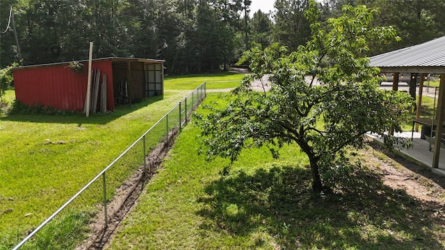 2301 Hines Lake Rd, Coldspring, TX 77331 - view of yard with an outbuilding and a view of trees
