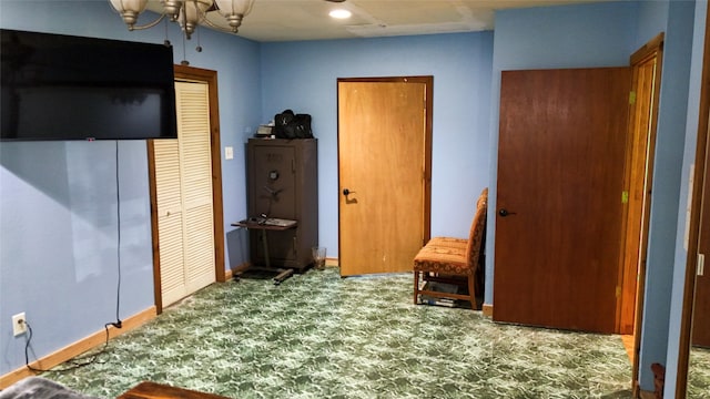 2301 Hines Lake Rd, Coldspring, TX 77331 - bedroom featuring carpet flooring, a closet, baseboards, and a chandelier
