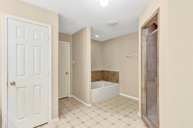 461 Mystic Glen Loop, Houston, TX 77339 - bathroom with baseboards, a bath, a stall shower, and tile patterned floors