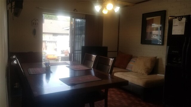 7267 Cook Rd, Houston, TX 77072 - dining room featuring ceiling fan and brick wall