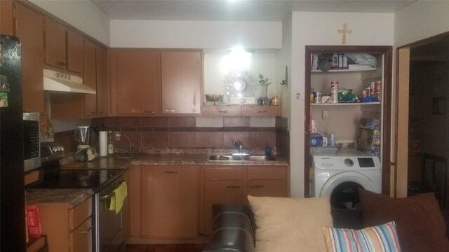 7267 Cook Rd, Houston, TX 77072 - kitchen featuring a sink, black range with electric cooktop, under cabinet range hood, backsplash, and washer / clothes dryer