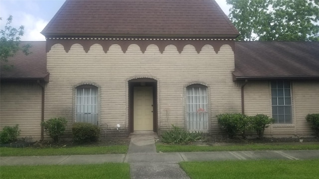 7267 Cook Rd, Houston, TX 77072 - view of front of property featuring a shingled roof and brick siding