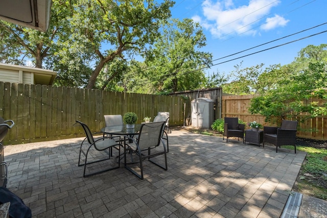 1919 Shadowdale Dr, Houston, TX 77043 - fenced backyard with a patio and outdoor dining area