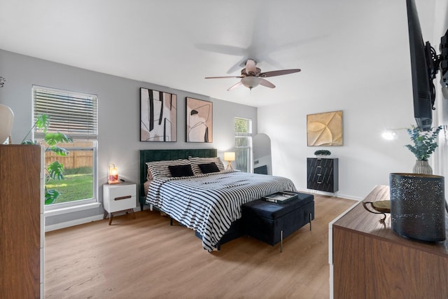 1919 Shadowdale Dr, Houston, TX 77043 - bedroom with light wood-type flooring, baseboards, and ceiling fan