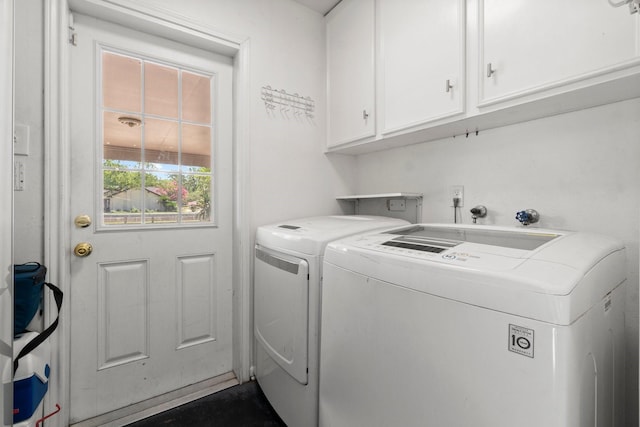 1919 Shadowdale Dr, Houston, TX 77043 - laundry area with cabinet space and washing machine and clothes dryer