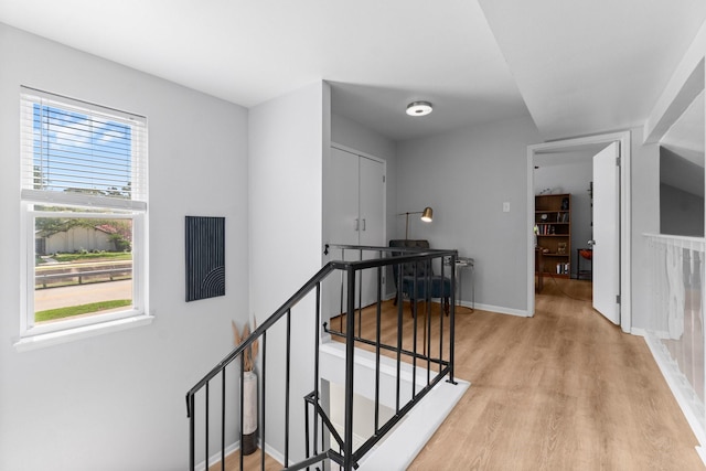 1919 Shadowdale Dr, Houston, TX 77043 - corridor featuring light wood-style flooring, an upstairs landing, and baseboards