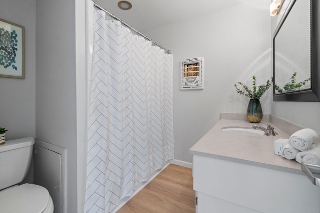 1919 Shadowdale Dr, Houston, TX 77043 - bathroom featuring vanity, toilet, wood finished floors, and a shower with curtain