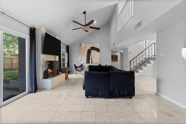 1919 Shadowdale Dr, Houston, TX 77043 - living area with ceiling fan, a fireplace, stairway, baseboards, and high vaulted ceiling