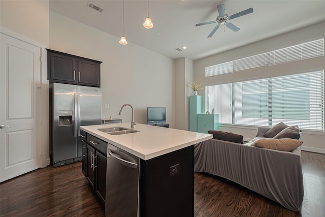 72 N Hutcheson St, Houston, TX 77003 - kitchen with appliances with stainless steel finishes, a sink, open floor plan, and dark wood-type flooring
