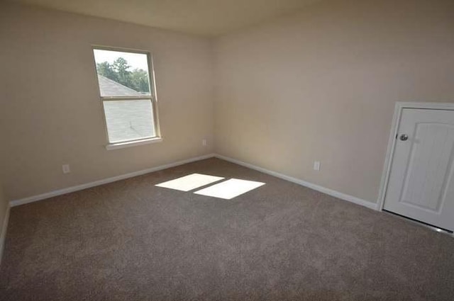 995 Arbor Gln, Conroe, TX 77303 - carpeted spare room featuring baseboards