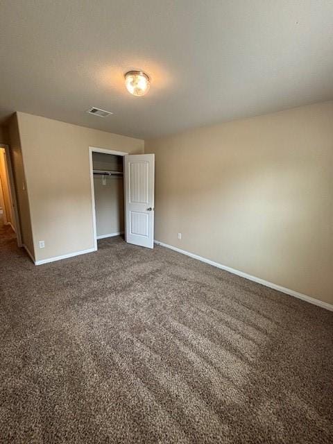 995 Arbor Gln, Conroe, TX 77303 - unfurnished bedroom featuring carpet floors and baseboards