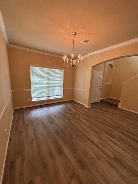 995 Arbor Gln, Conroe, TX 77303 - empty room with a chandelier, crown molding, dark wood-type flooring, arched walkways, and baseboards