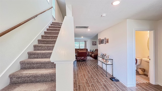 706 Hardwood Grove Ct, Houston, TX 77090 - stairs with wood finish floors, baseboards, and recessed lighting