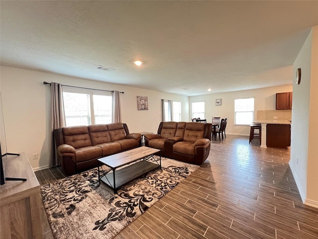 706 Hardwood Grove Ct, Houston, TX 77090 - living room with baseboards, dark wood-style floors, and recessed lighting