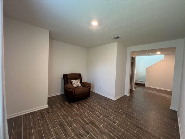 706 Hardwood Grove Ct, Houston, TX 77090 - unfurnished room with baseboards, dark wood-style flooring, recessed lighting, and a textured ceiling