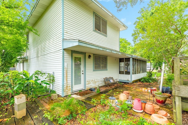 204 Caladium St, Lake Jackson, TX 77566 - back of house featuring a sunroom