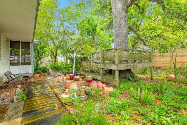 204 Caladium St, Lake Jackson, TX 77566 - view of yard featuring a wooden deck