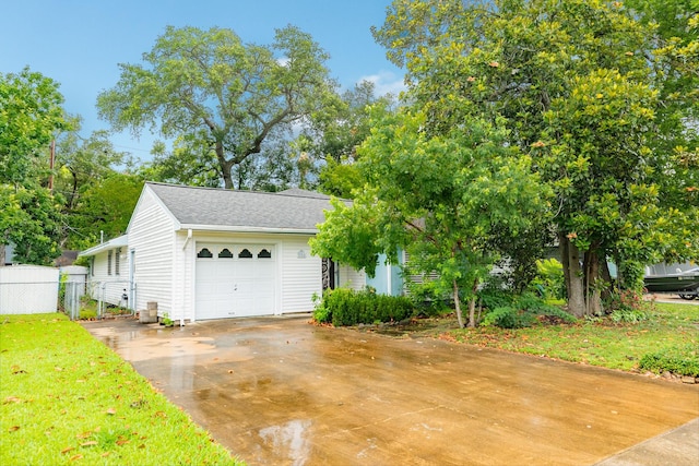 204 Caladium St, Lake Jackson, TX 77566 - view of front of property with a garage, concrete driveway, and a shingled roof